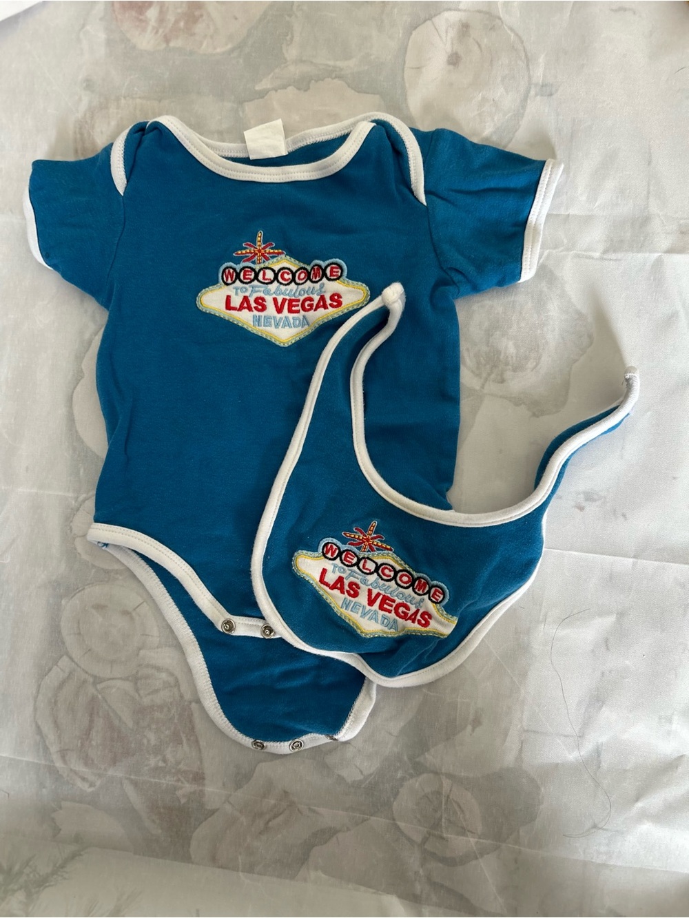 Las Vegas Graphic Teal Baby Onesie with Matching Bib